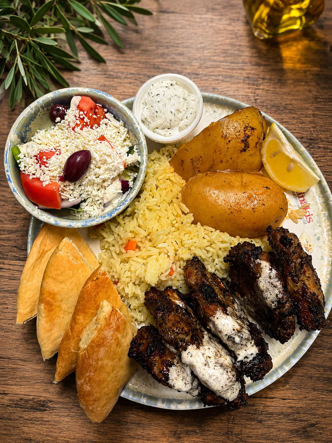 A Mediterranean dinner with salad, rice and roasted potatoes